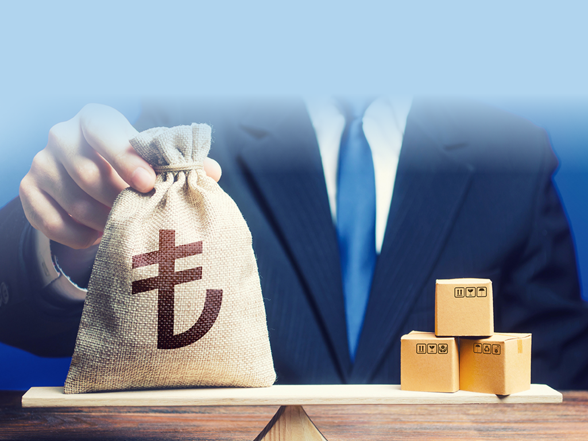 Turkish lira money bag and boxes on scales. Trade balance and purchasing power. Economic and industrial development. Import and export duties, profit from the sale of value added goods. VAT