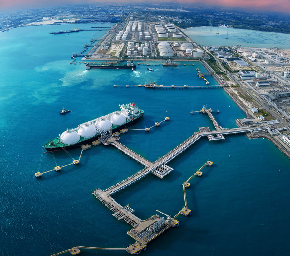 LNG (Liquified Natural Gas) tanker anchored in Gas terminal gas tanks for storage. Oil Crude Gas Tanker Ship. LPG at Tanker Bay Petroleum Chemical or Methane freighter export import transportation and logistics